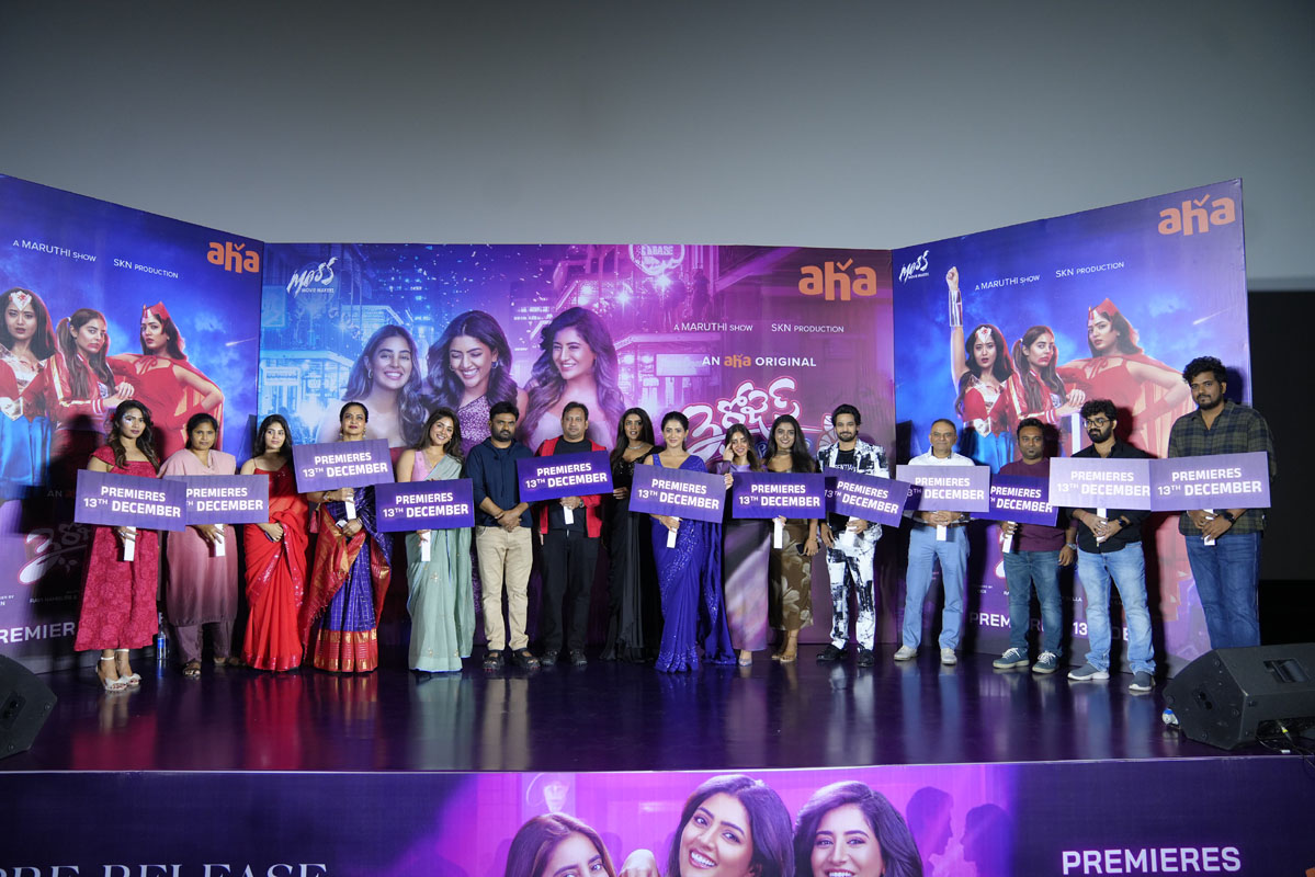 Team holding Premieres 13th December board