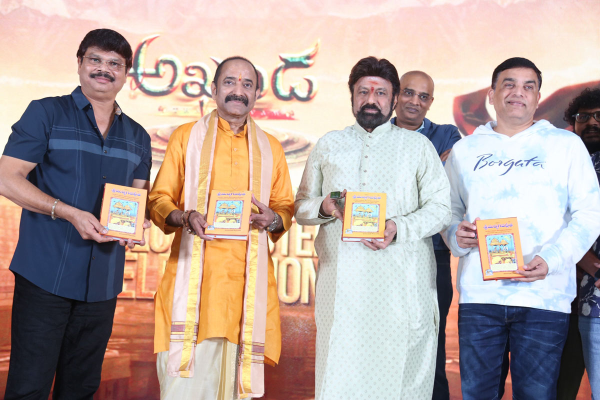 Balakrishna Boyapati Srinu Dil Raju posing with Bhagavad Gita