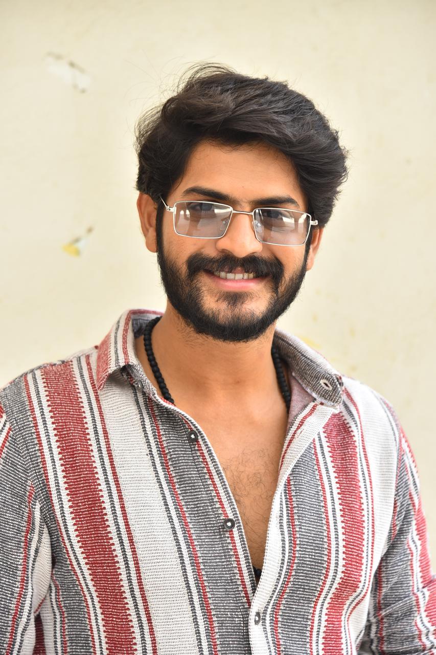 Akhil Raj Uddemari smart casual look with glasses