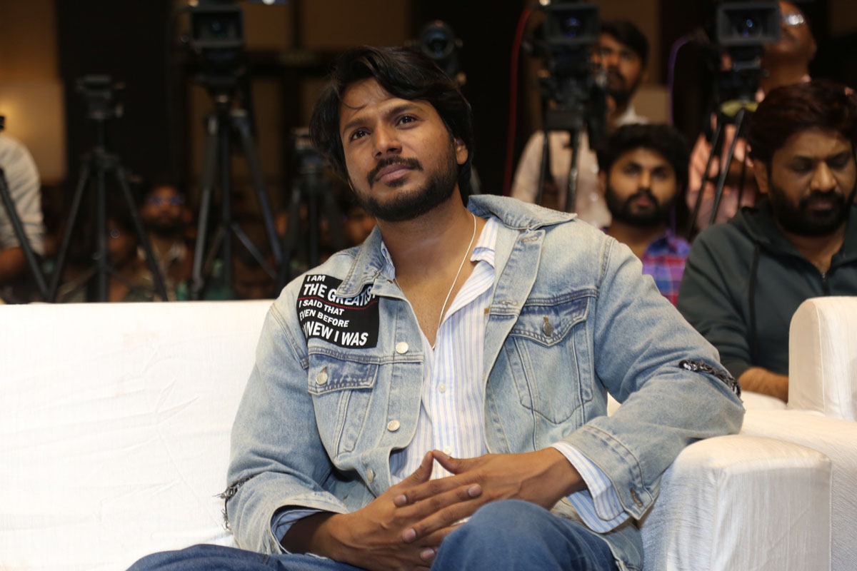 Sundeep Kishan seated calmly at film event