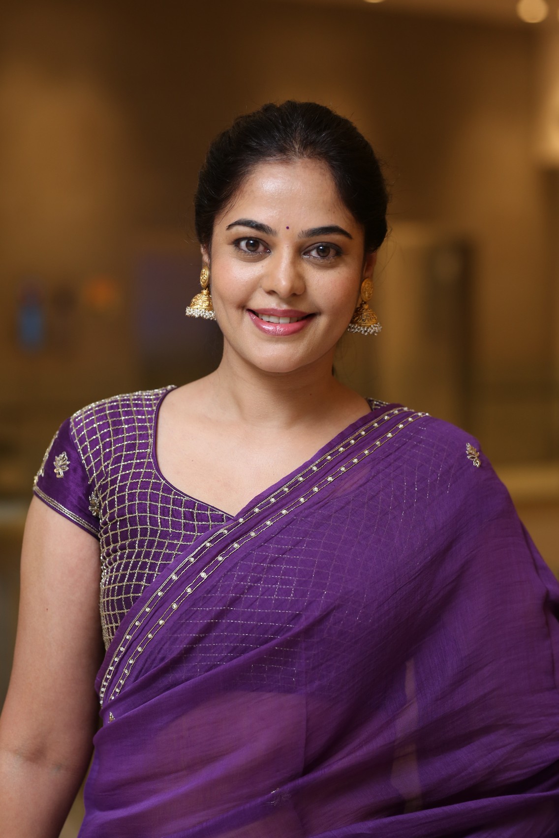 Bindu Madhavi radiating elegance in regal purple saree