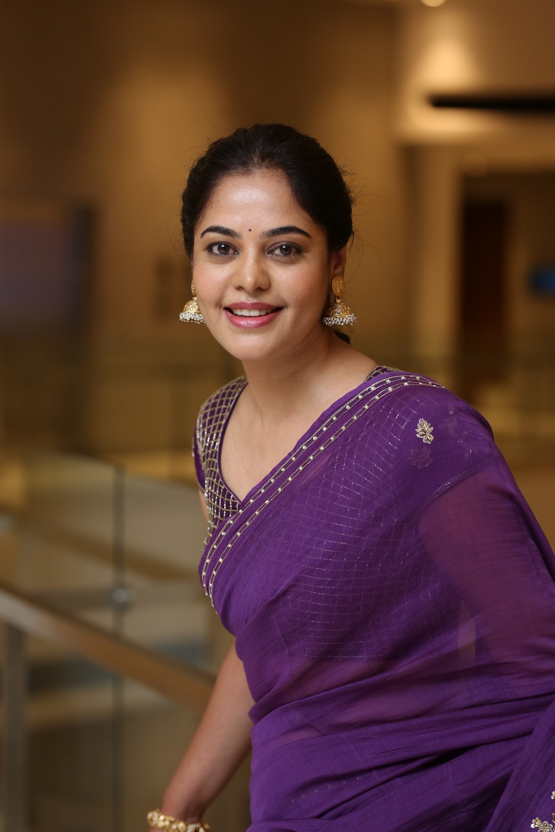 Bindu Madhavi glowing gracefully in timeless purple attire