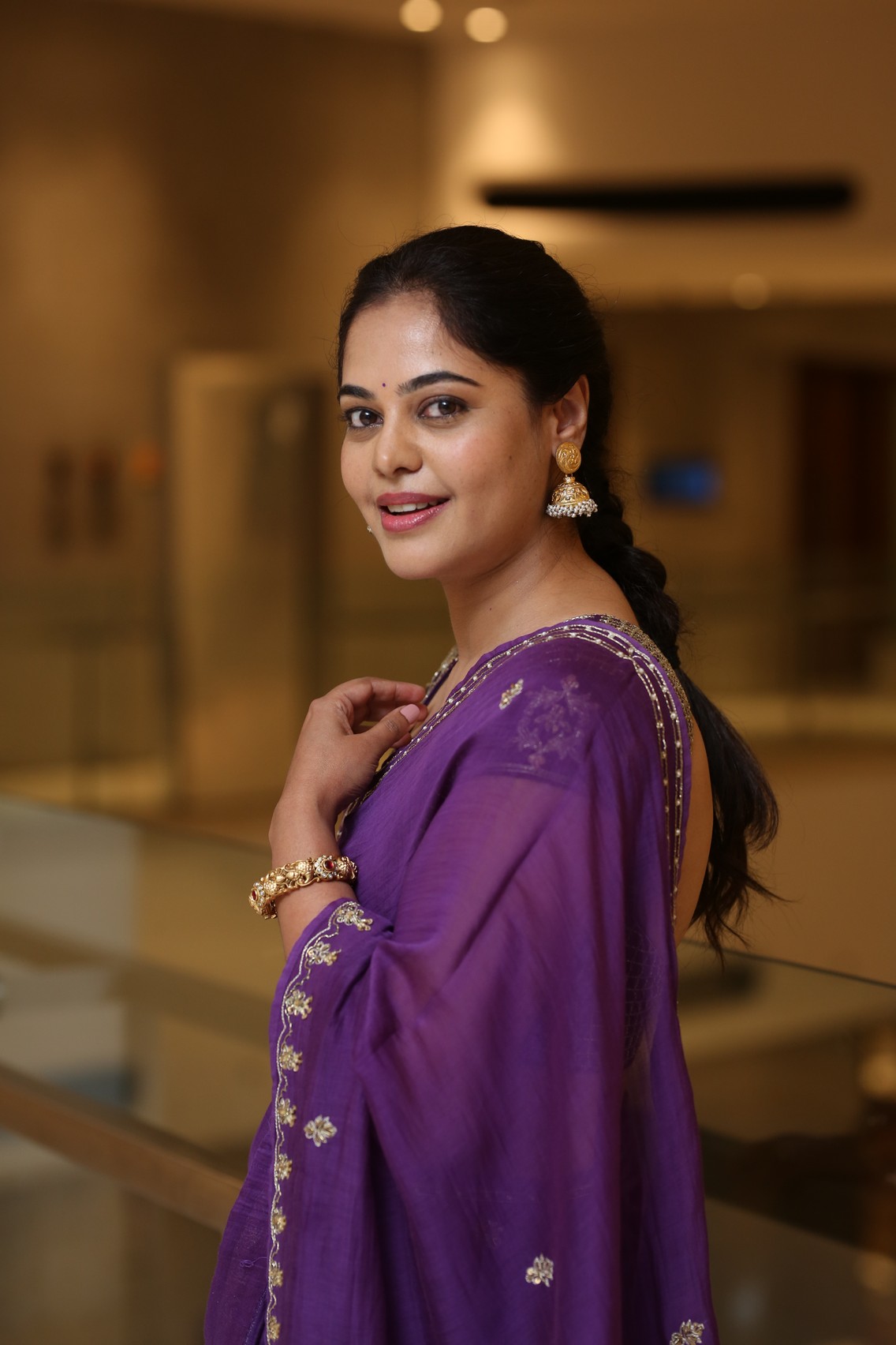 Bindu Madhavi showcasing royal charm in purple saree