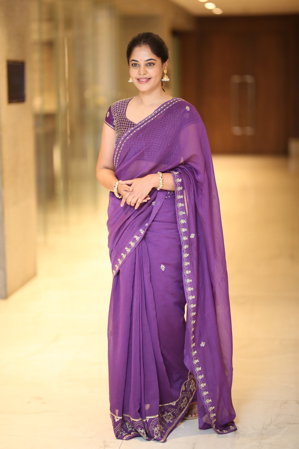 Bindu Madhavi shining confidently in regal purple ensemble