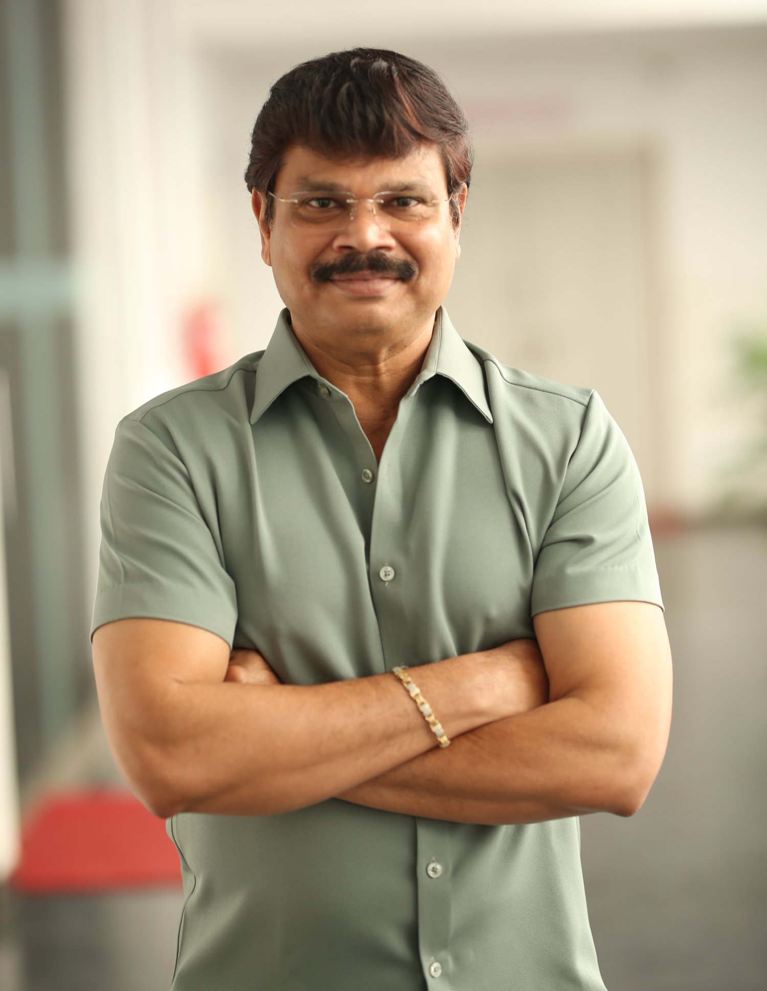 Boyapati Srinu posing with composed expression and elegant style