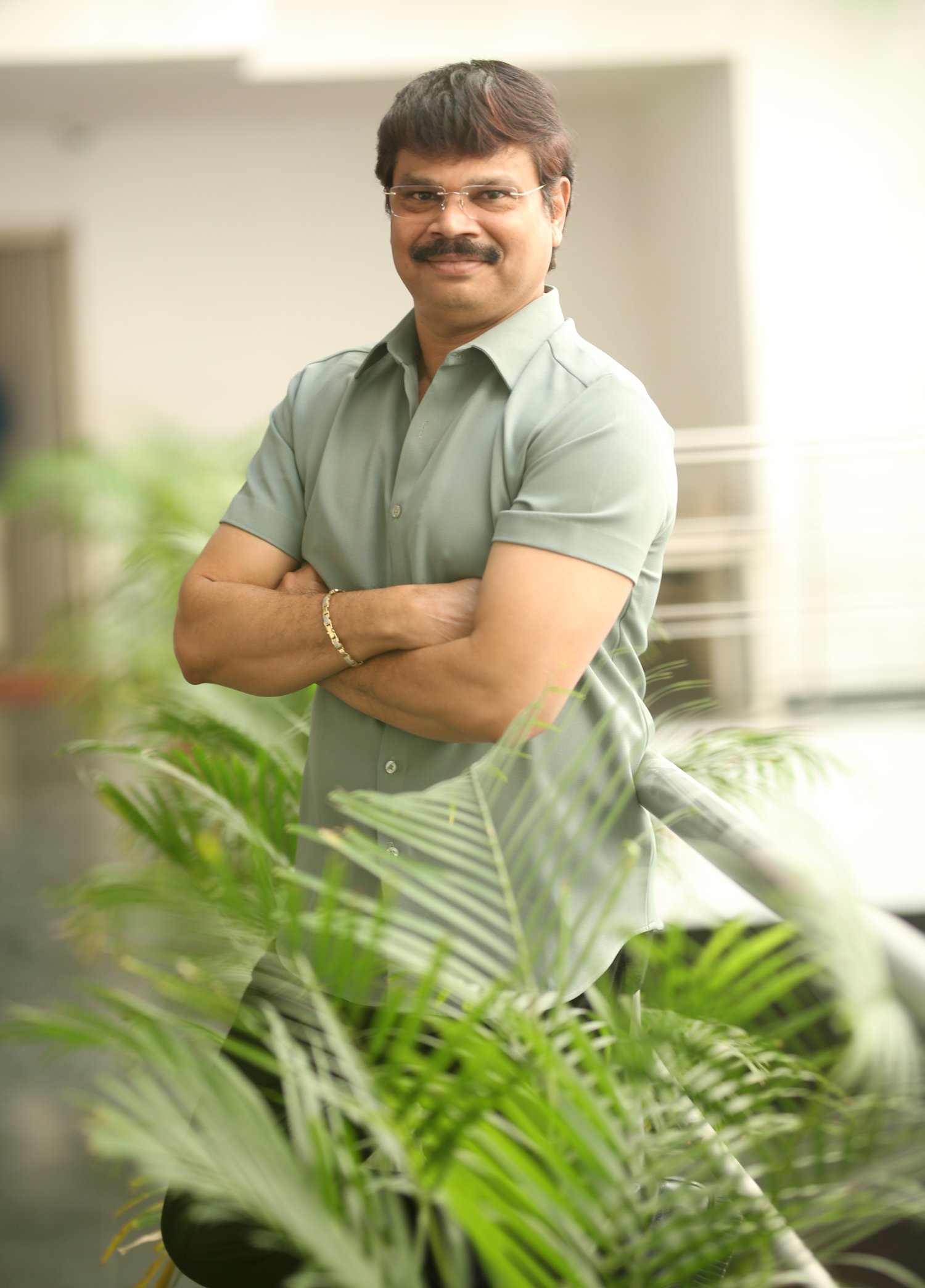 Boyapati Srinu in sharp outfit with confident demeanor