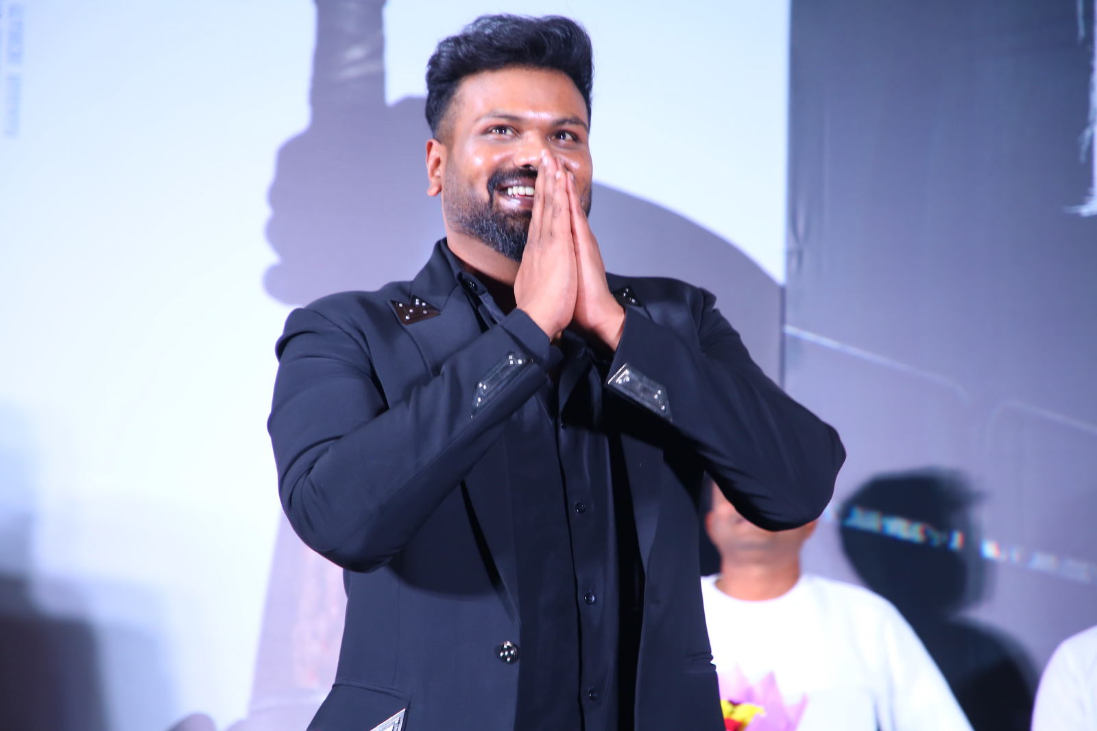 Manchu Manoj greeting audience with folded hands on stage