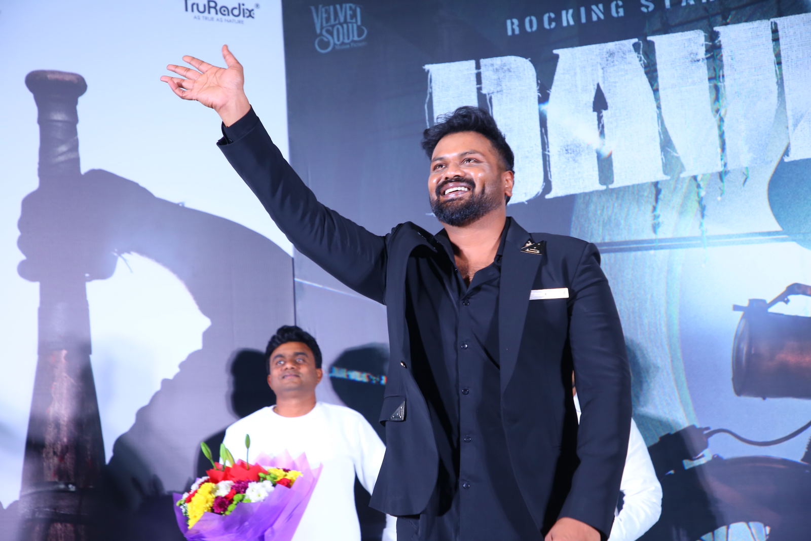 Manchu Manoj waving to audience at movie event