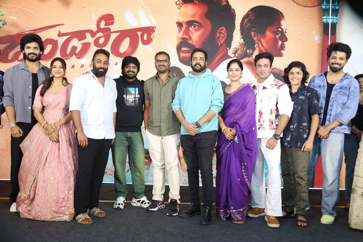 Dhandoraa cast and makers posing together on stage