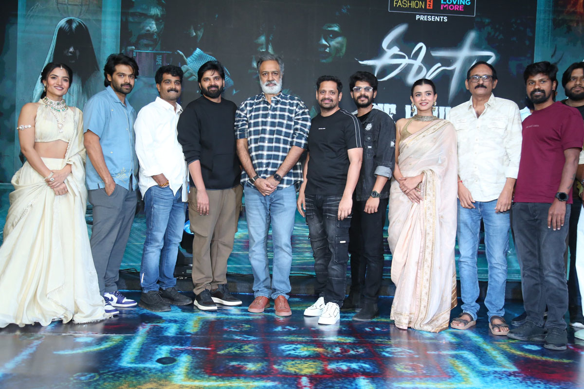 Film team posing together for media photos