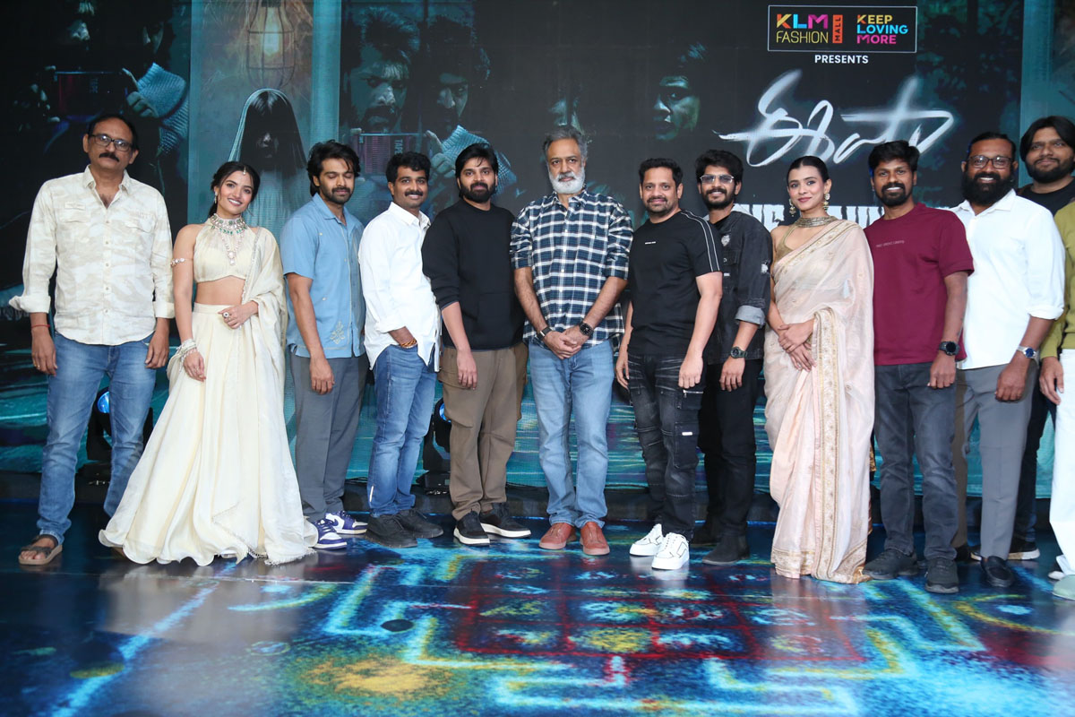 Cast and crew posing for media