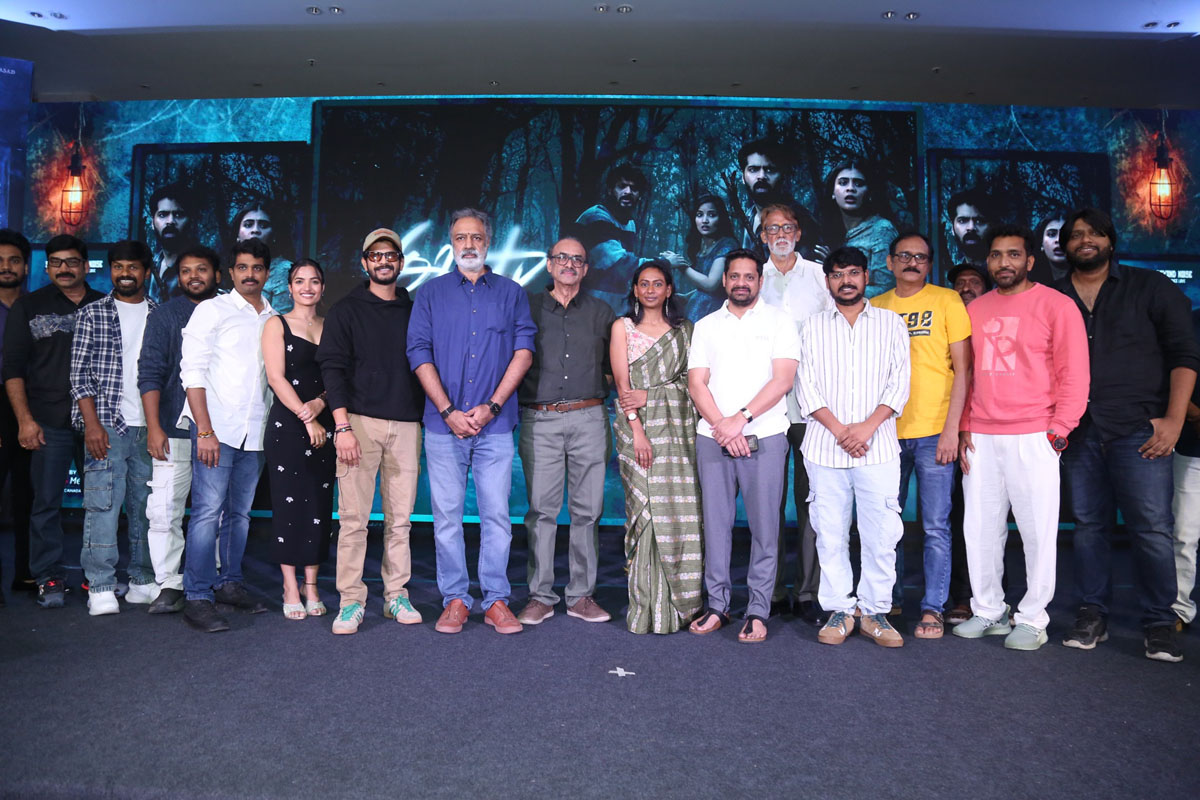 Team posing together for media photos