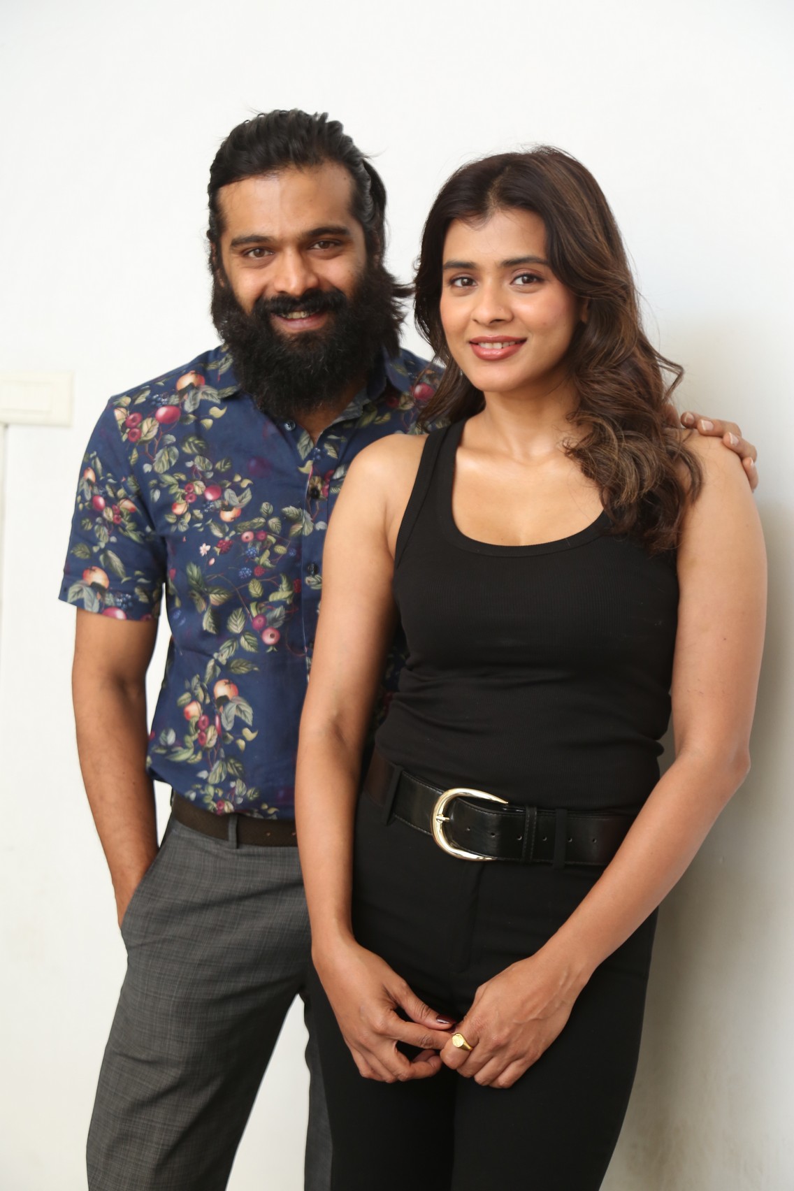 Thrigun and Hebah Patel striking stylish pose for press