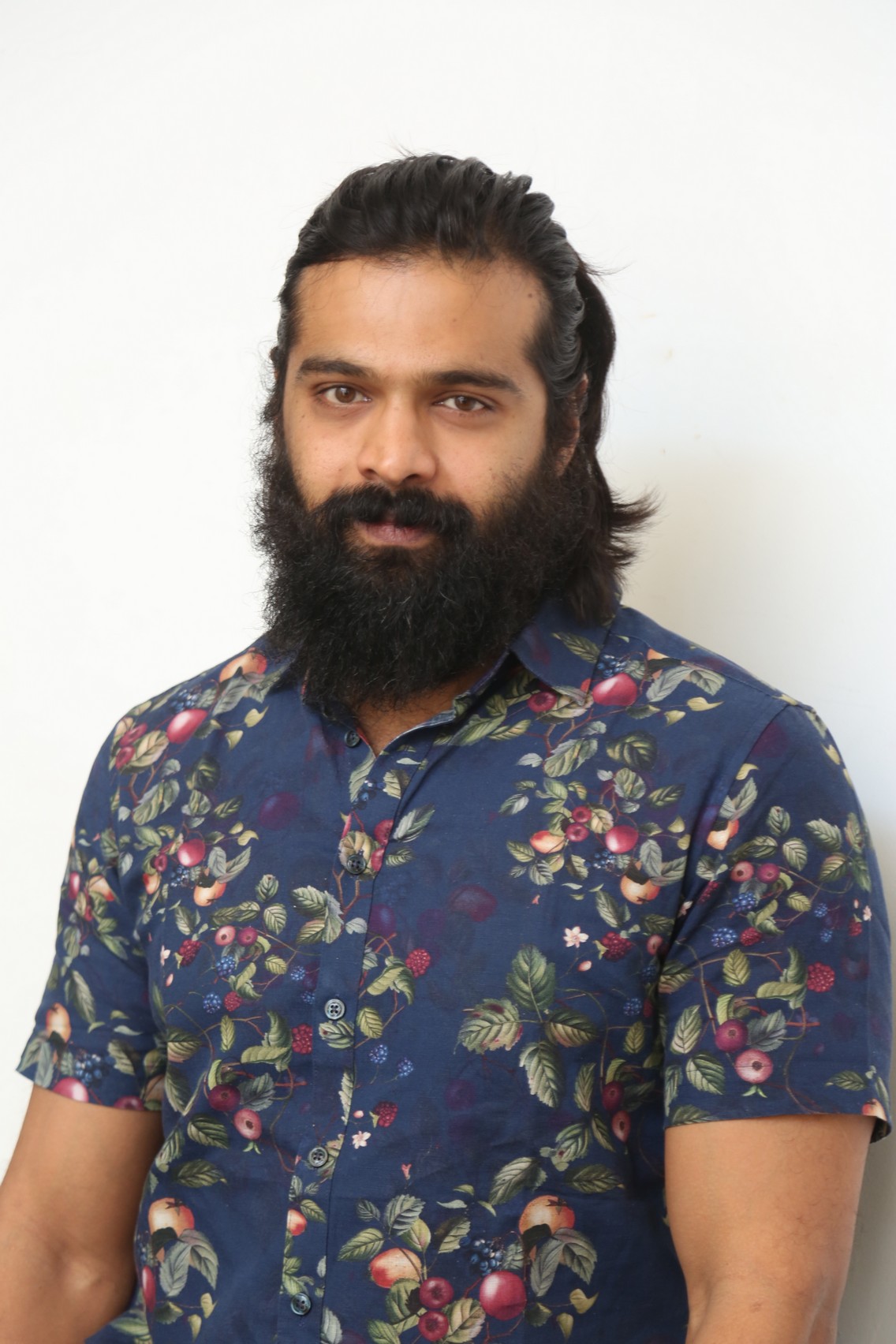 Thrigun posing confidently for cameras at event