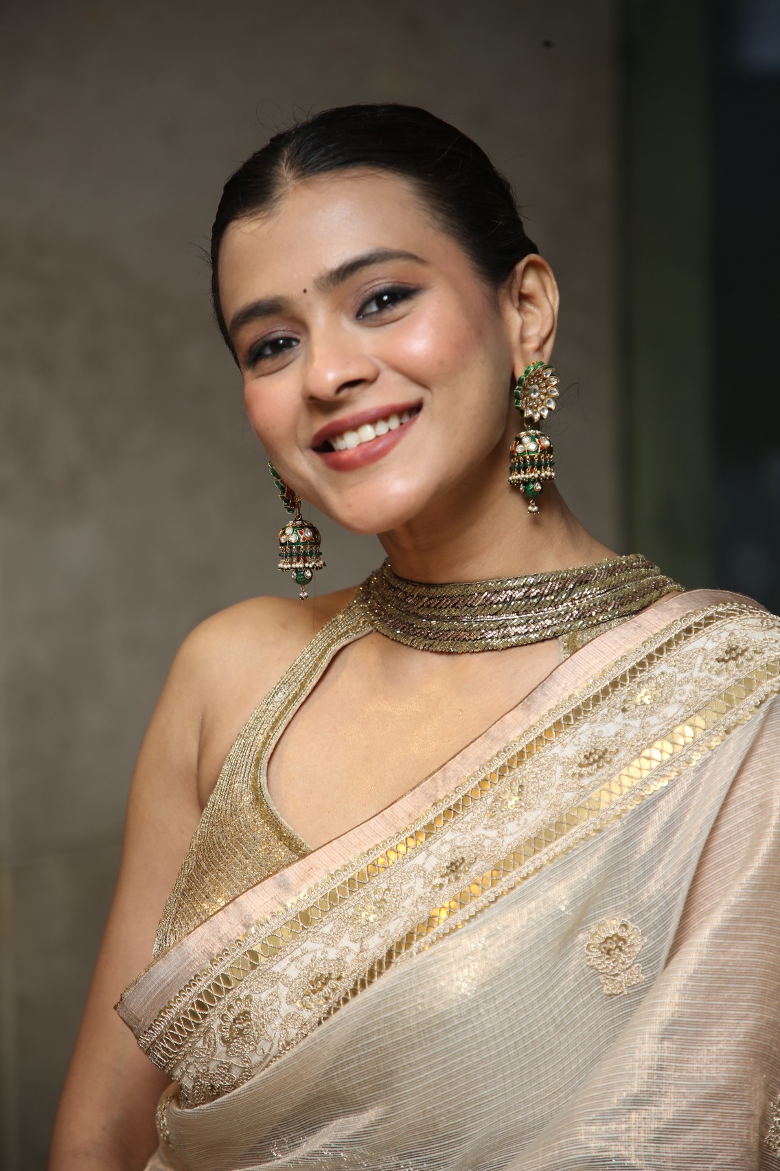 Hebah Patel wearing stunning saree with radiant smile