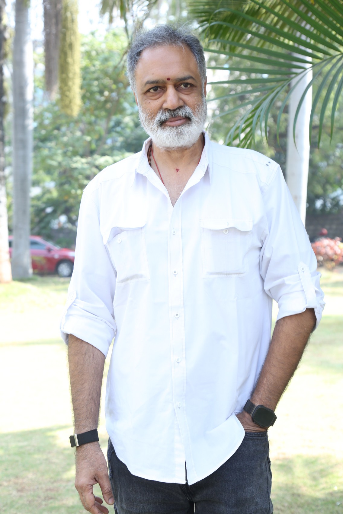 K. L. Damodar Prasad smiling in white shirt