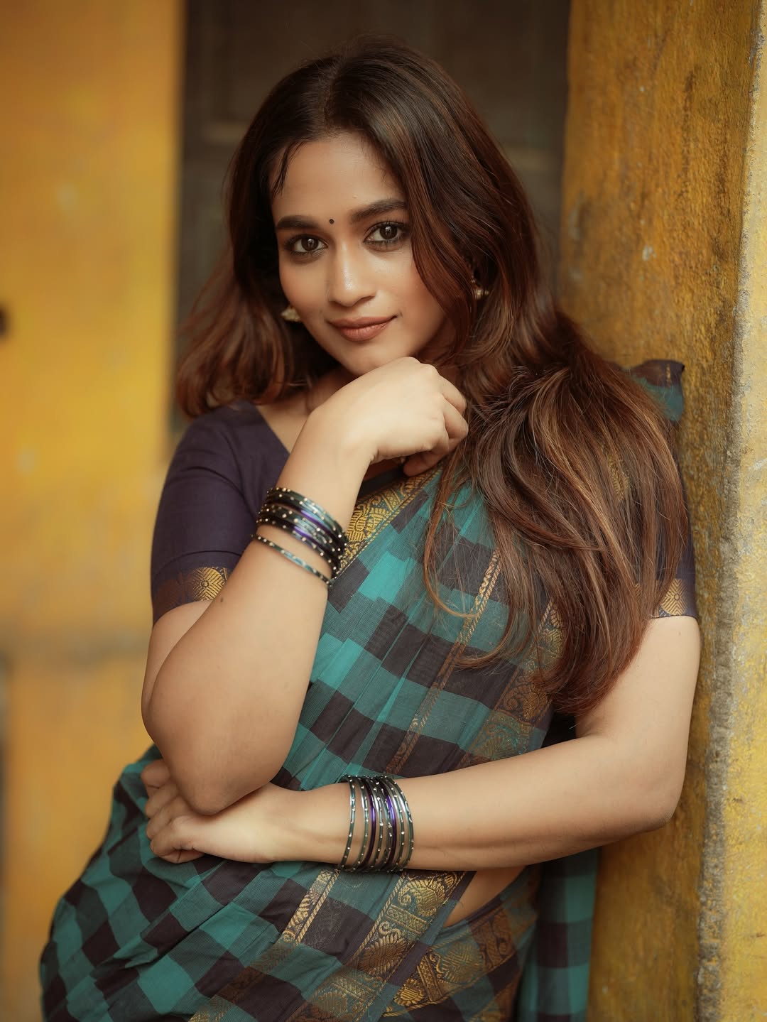 Kaavya Arivumani chic saree style with confident smile