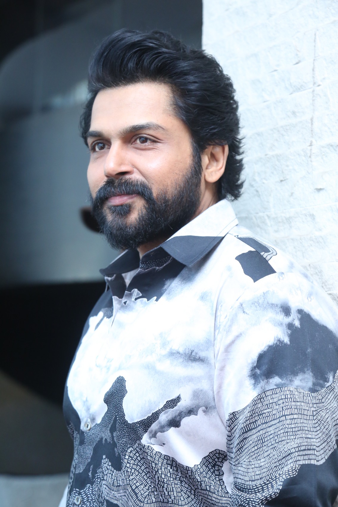 Karthi in sharp monochrome shirt with fun vibe