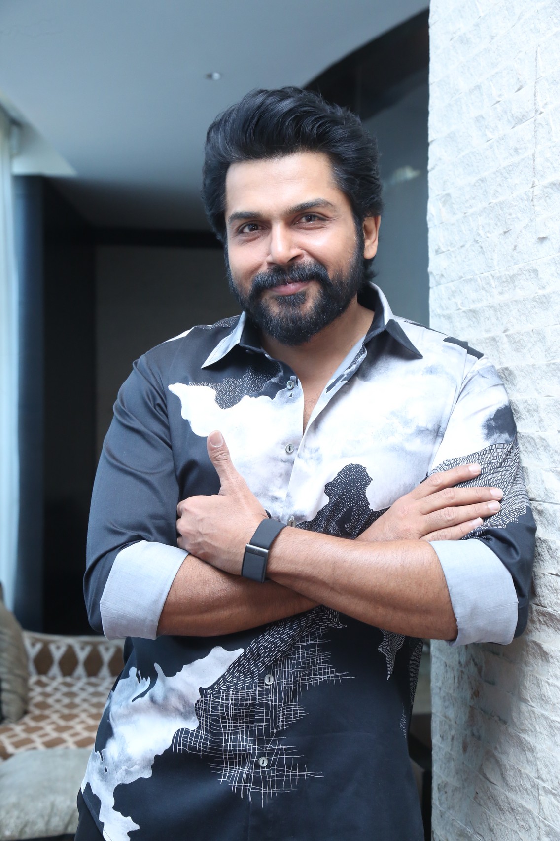 Karthi posing confidently with sharp shirt style