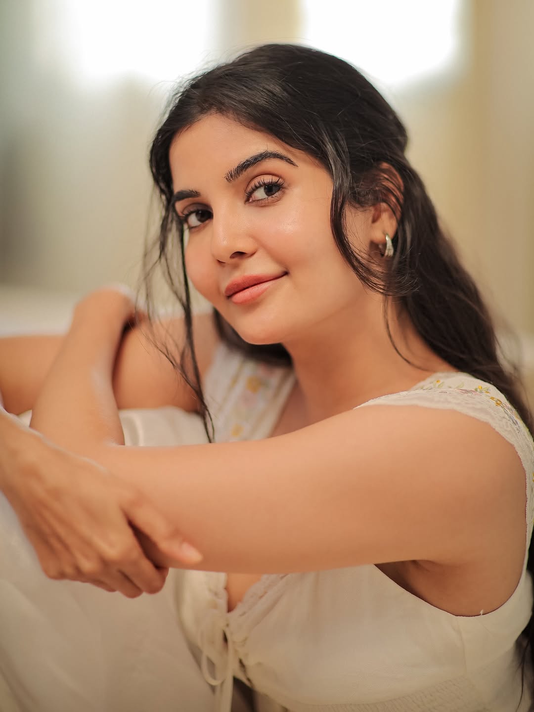 Madhuri Jain showcasing elegant style with a playful smile