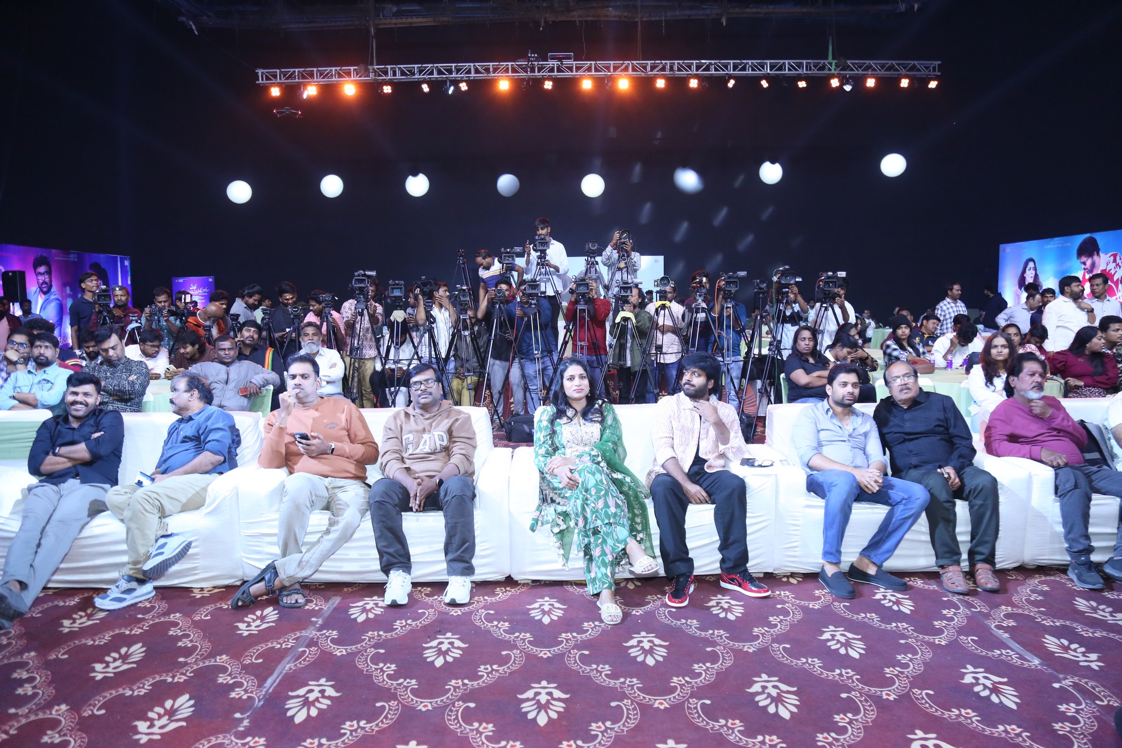 Guests seated with producer and director at event