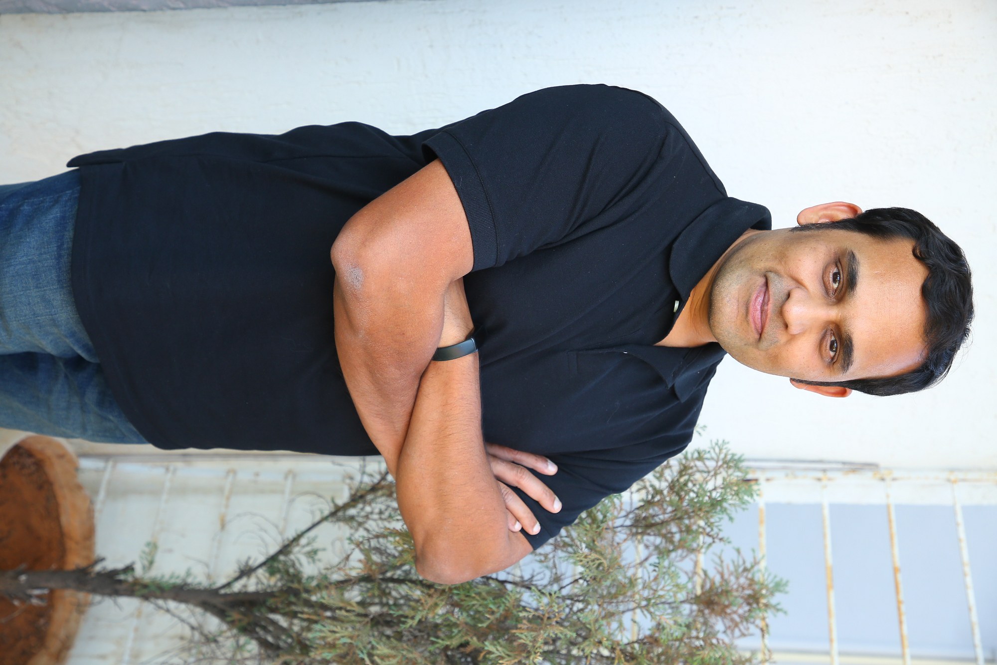 Mickey J Meyer posing confidently in black attire