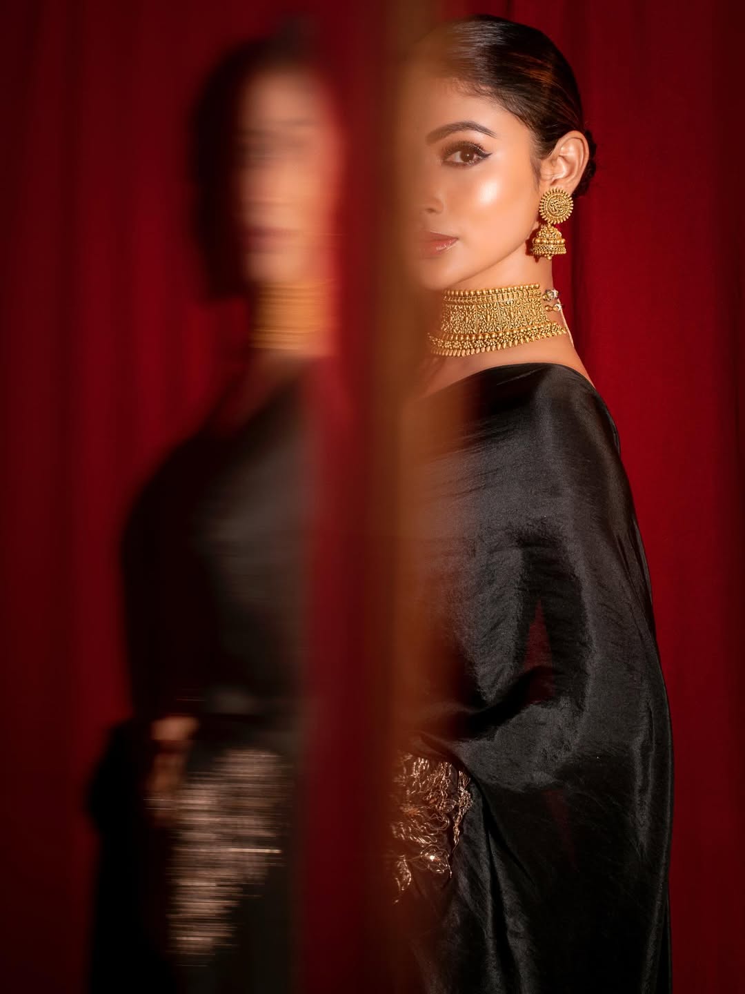 Mouni Roy posing with regal grace before mirror