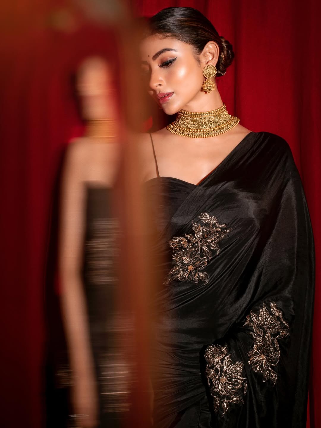 Mouni Roy in black saree with gold jewelry