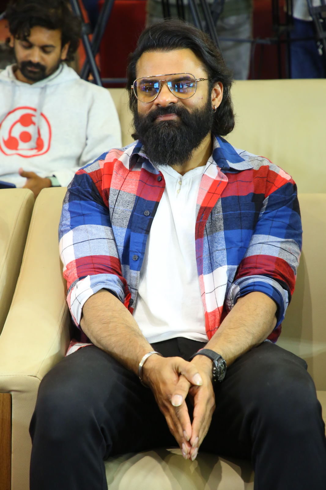 Sai Durgha Tej seated during event