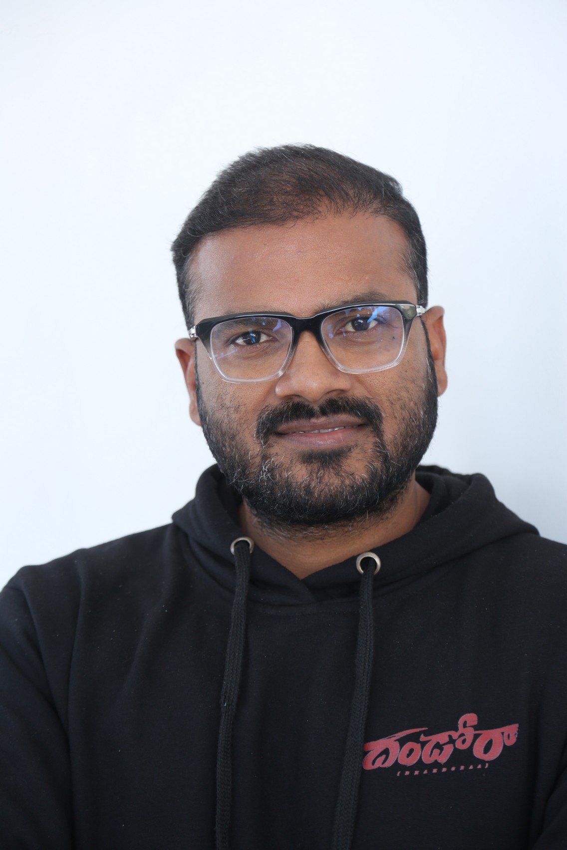 Muralikanth Devasoth wearing glasses and casual hoodie