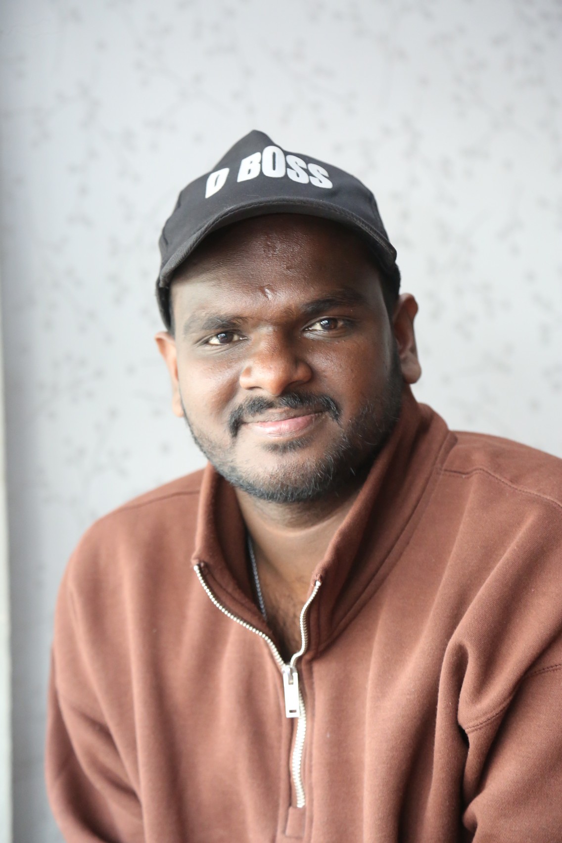 Nanduri Emmanuel rocking D Boss cap confidently