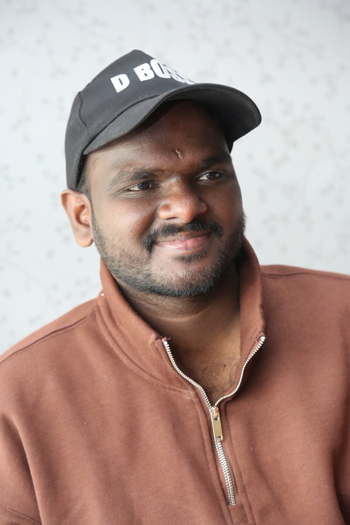 Nanduri Emmanuel cool street style with D Boss cap