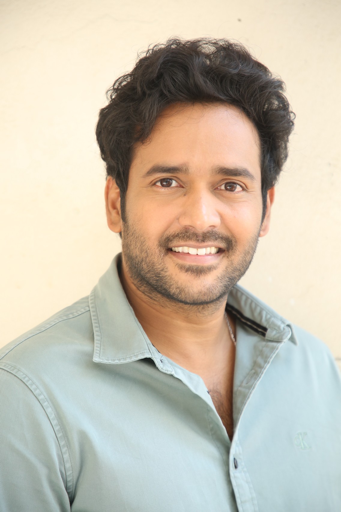 Naresh Agastya displaying polished style and confident smile