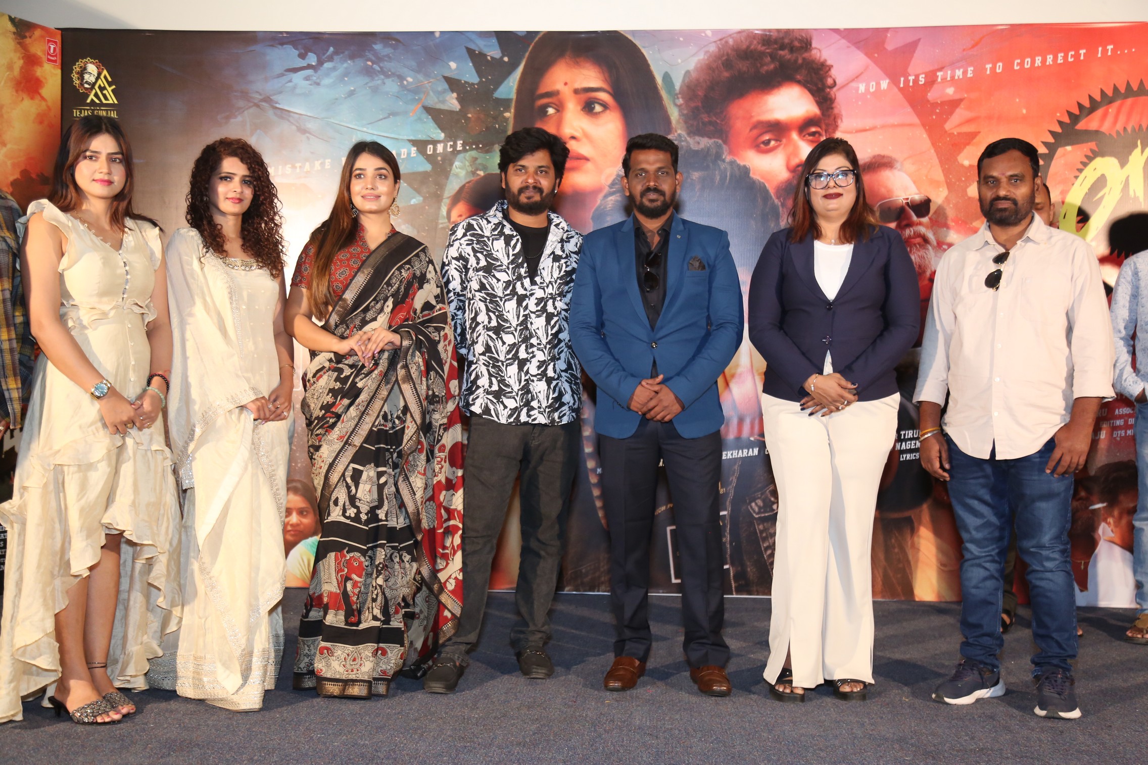 Cast and crew posing for media