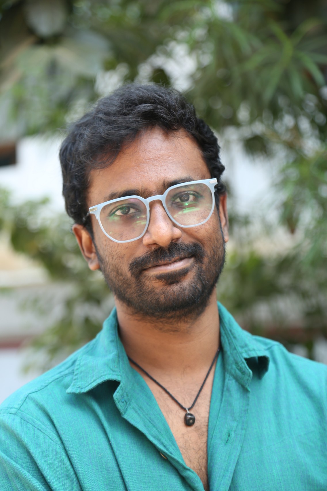 Praneeth Prattipati smart casual style with glasses