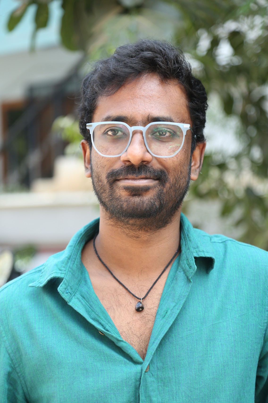 Praneeth Prattipati elegant look with classic glasses