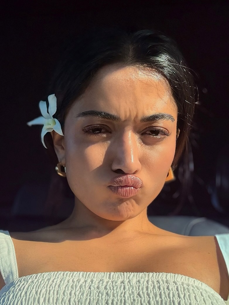 Rashmika Mandanna playful glow with stylish pout expression