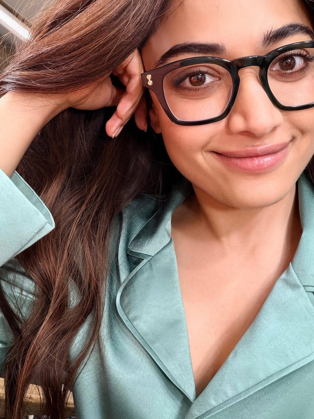 Rashmika Mandanna sparkling eyes behind stylish glasses