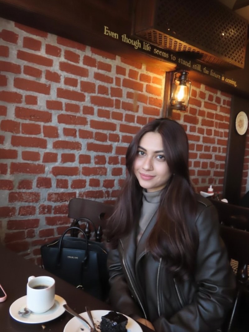 Reem Sameer Shaikh by brick wall in chic look