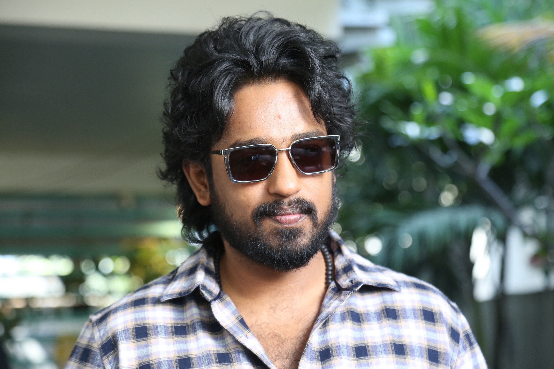 Roshan Kanakala in sleek shades and plaid