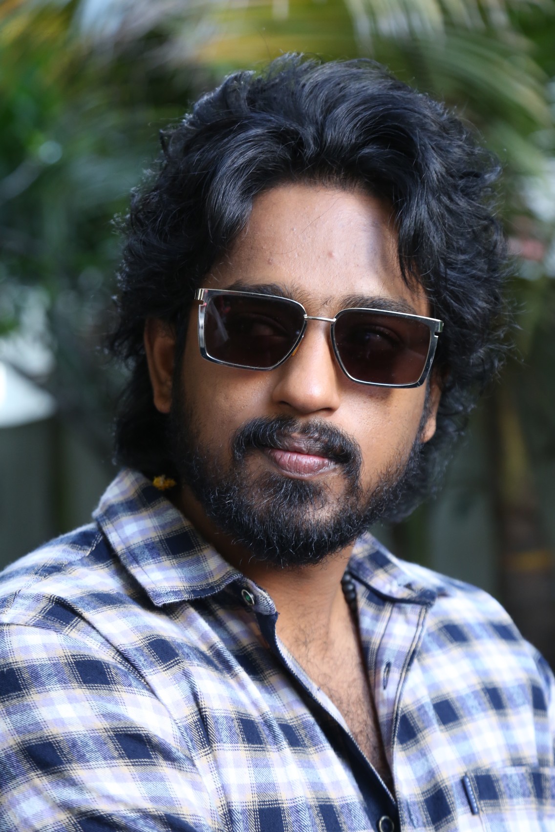 Roshan Kanakala showing confident style with sunglasses