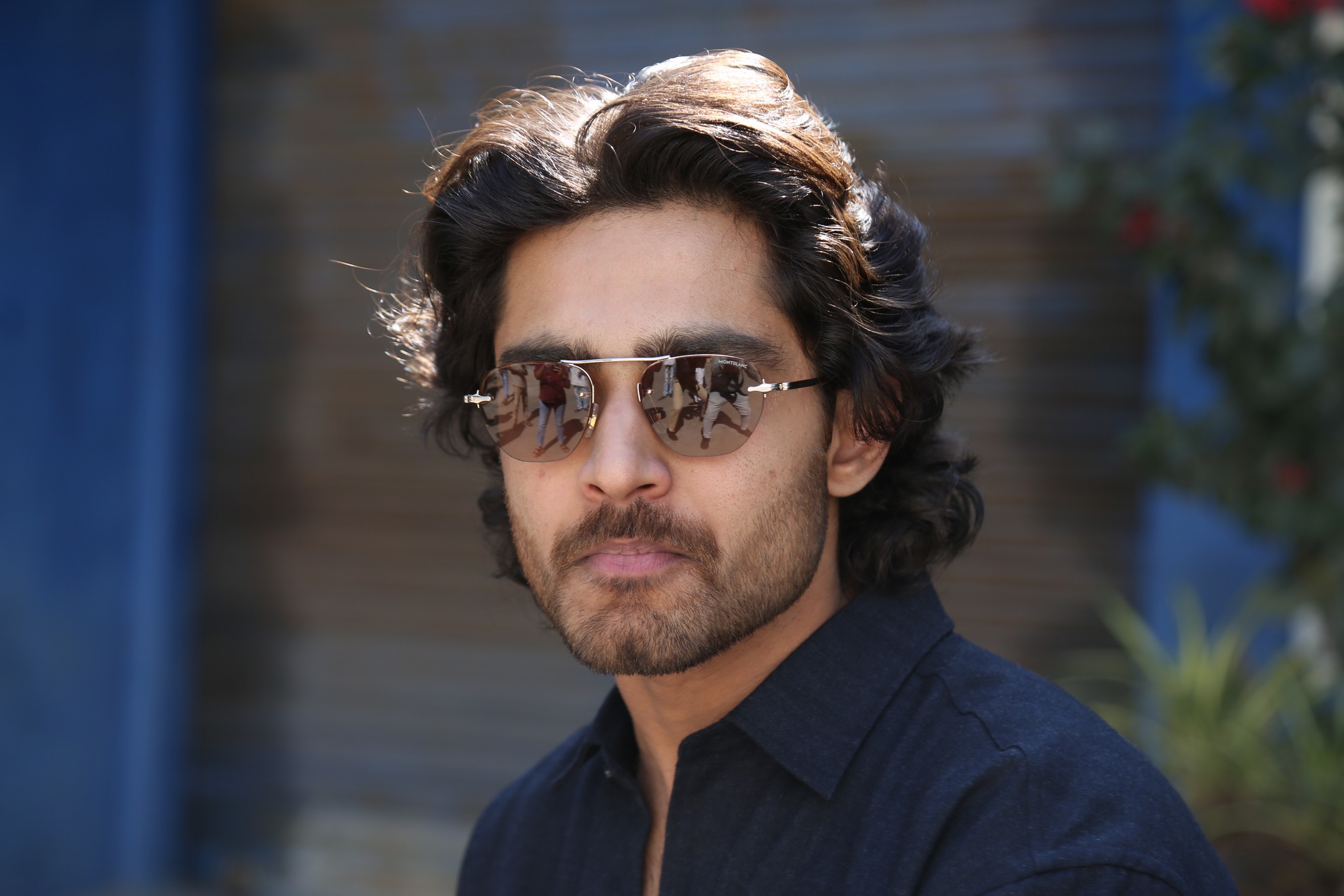 Roshann Meka showcasing Hollywood cool with reflective sunglasses