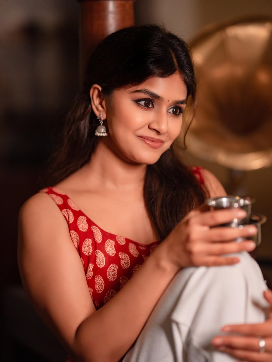 Sanjana Anand pairing elegance with coffee and chic vibes