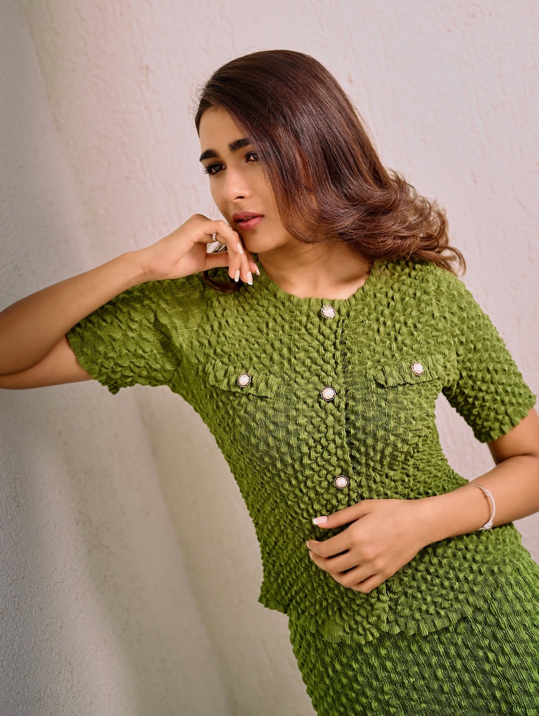 Shalini Pandey posing in emerald dress with confidence