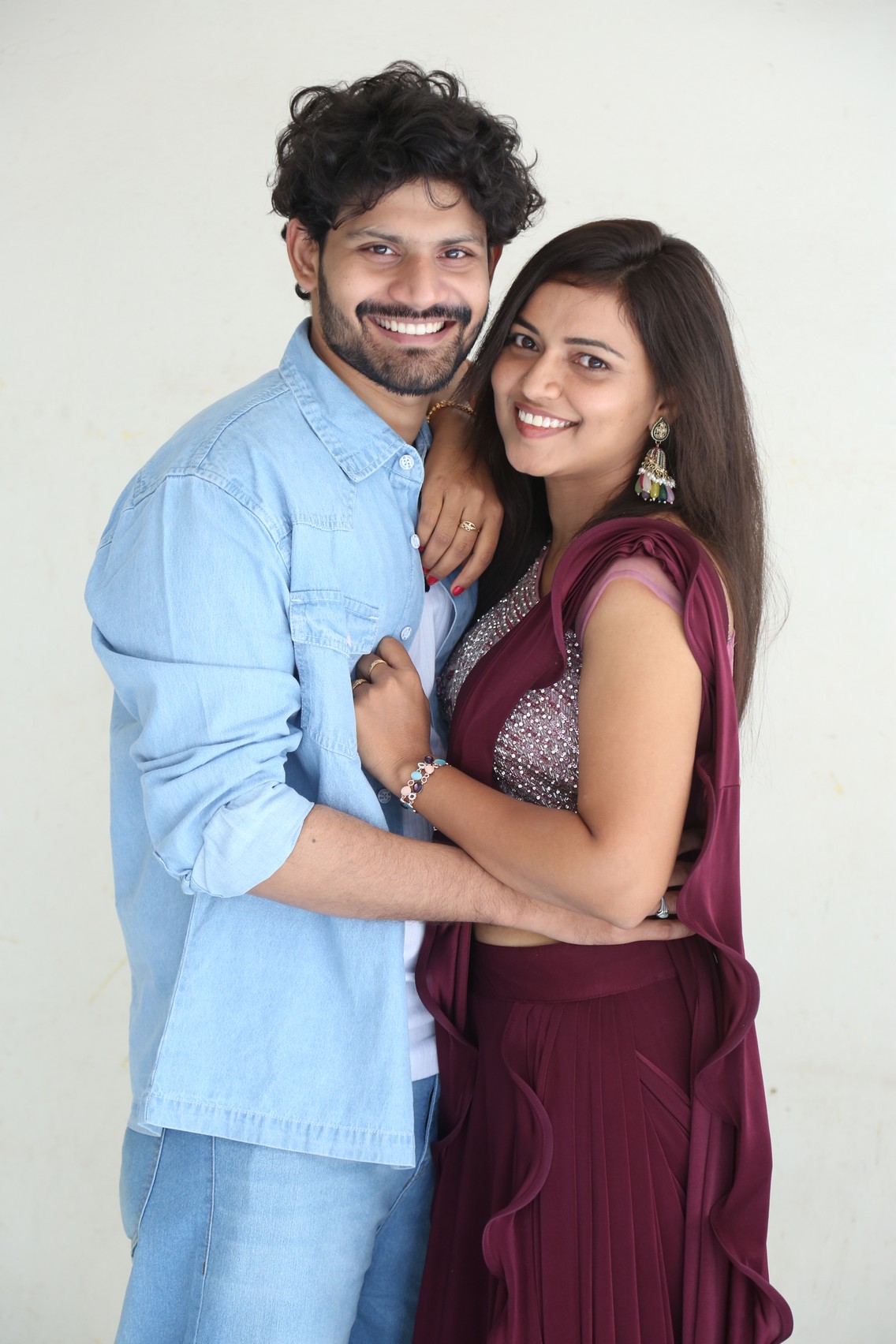 Siddu Gadi Love Story lead pair posing at press meet