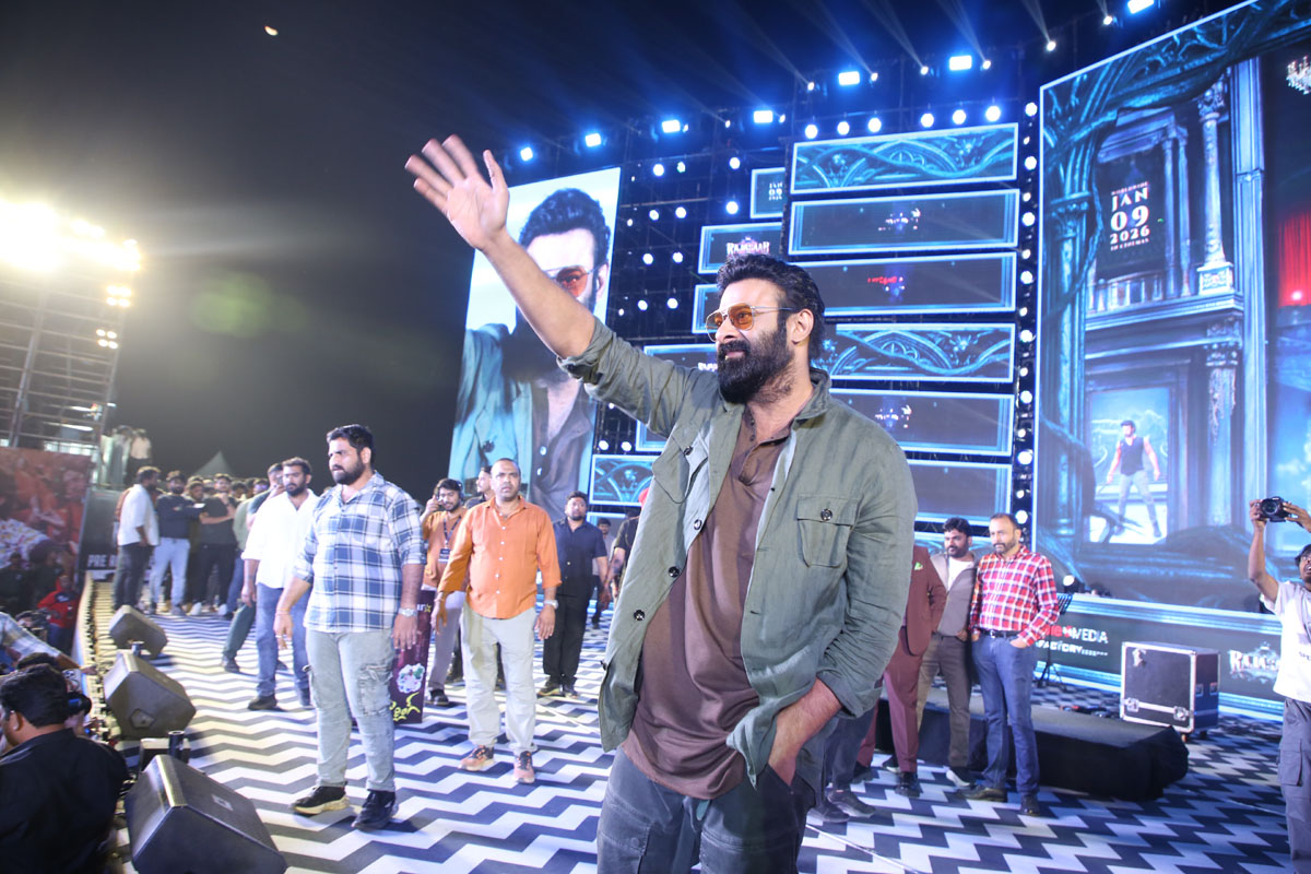 Prabhas waving to fans at the event
