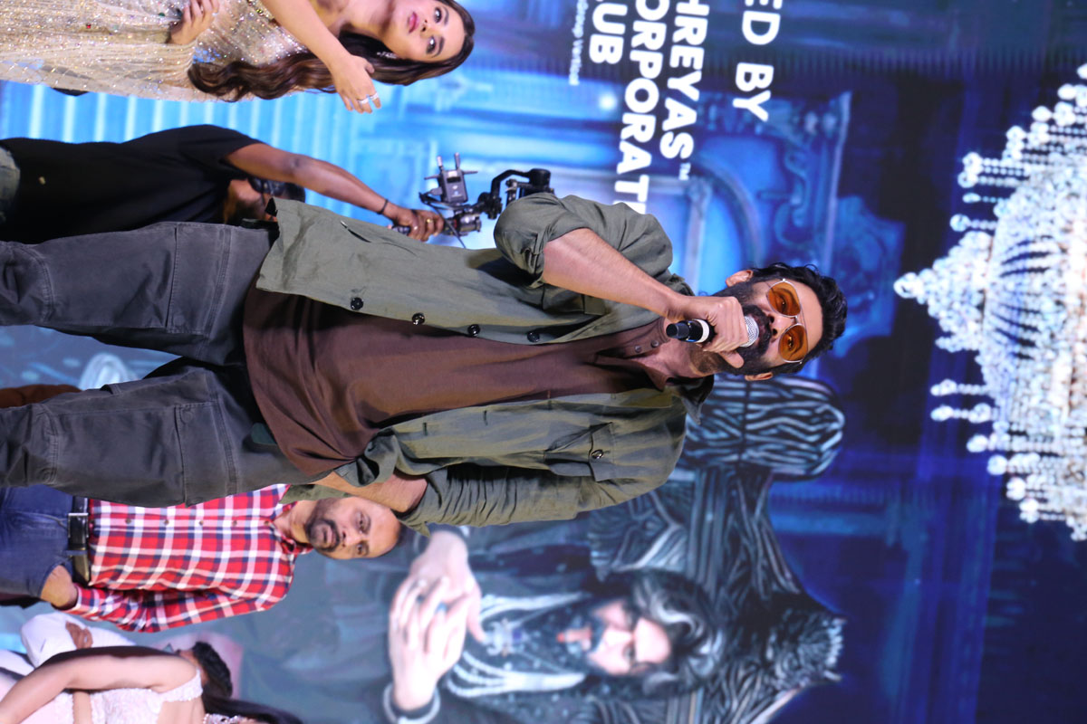 Prabhas delivering a speech on stage