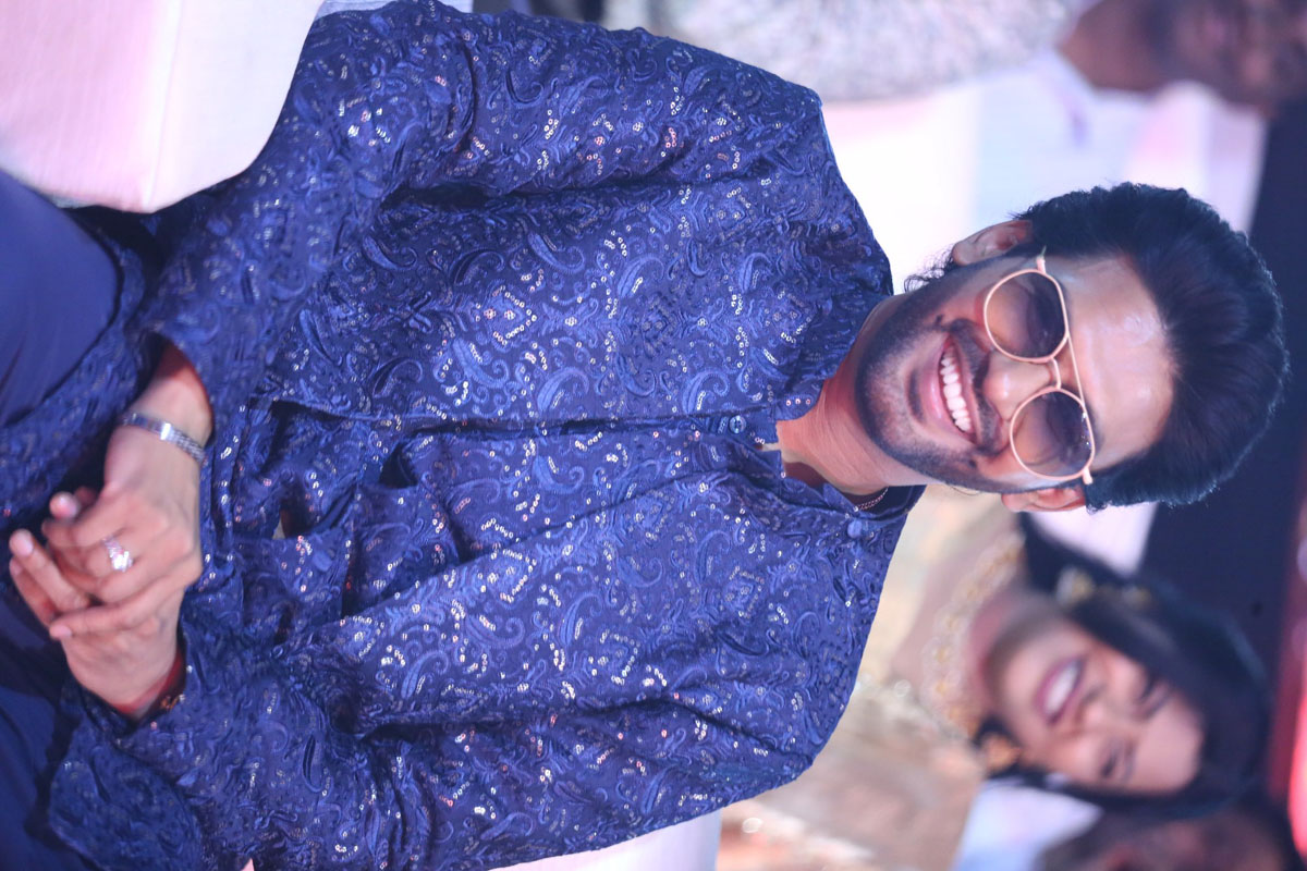 Naveen Polishetty wearing patterned blue look with swag