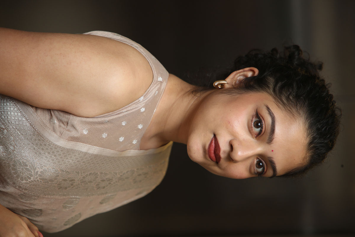 Varsha Bollamma glowing in elegant saree with subtle smile