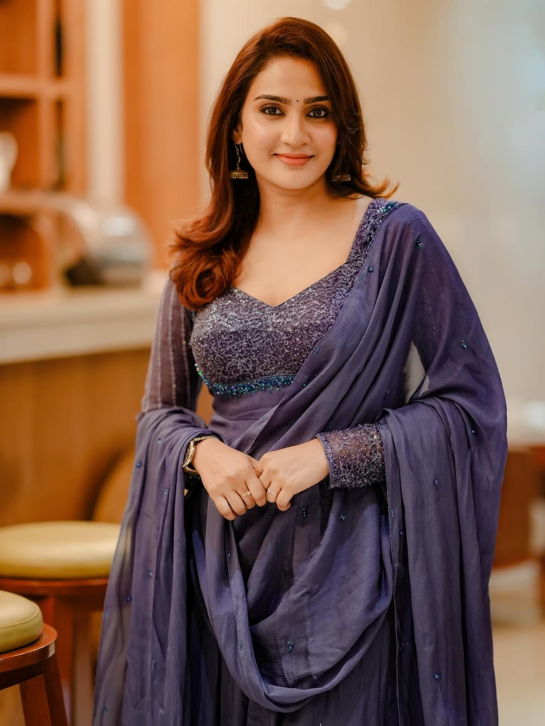 Aditi Ravi turns heads in elegant purple saree